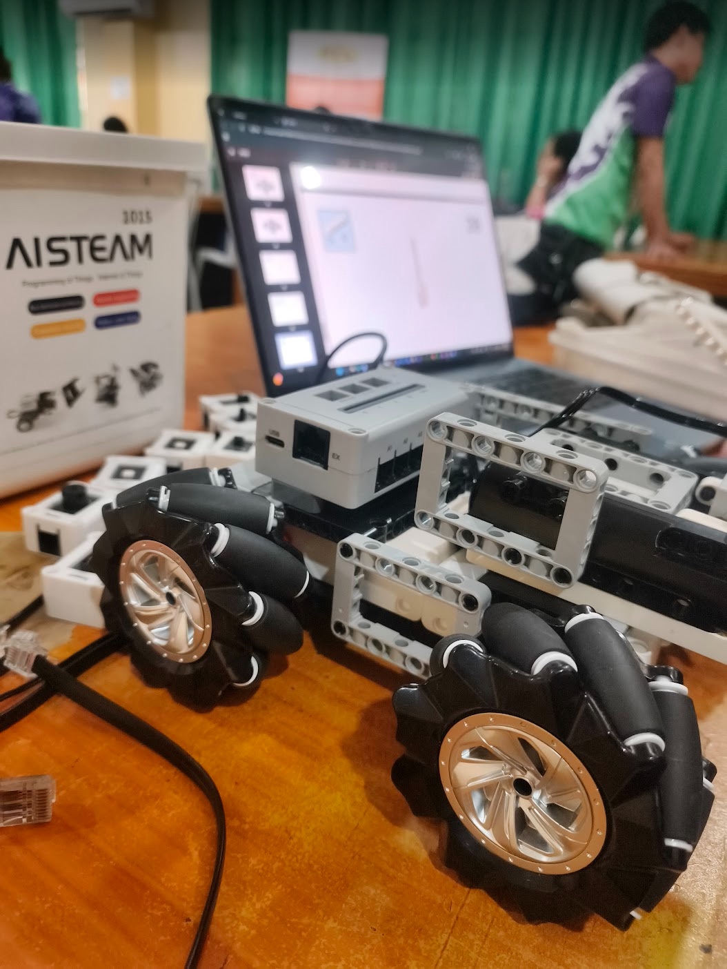 AISTEAM programmable mobile robot beside its control software