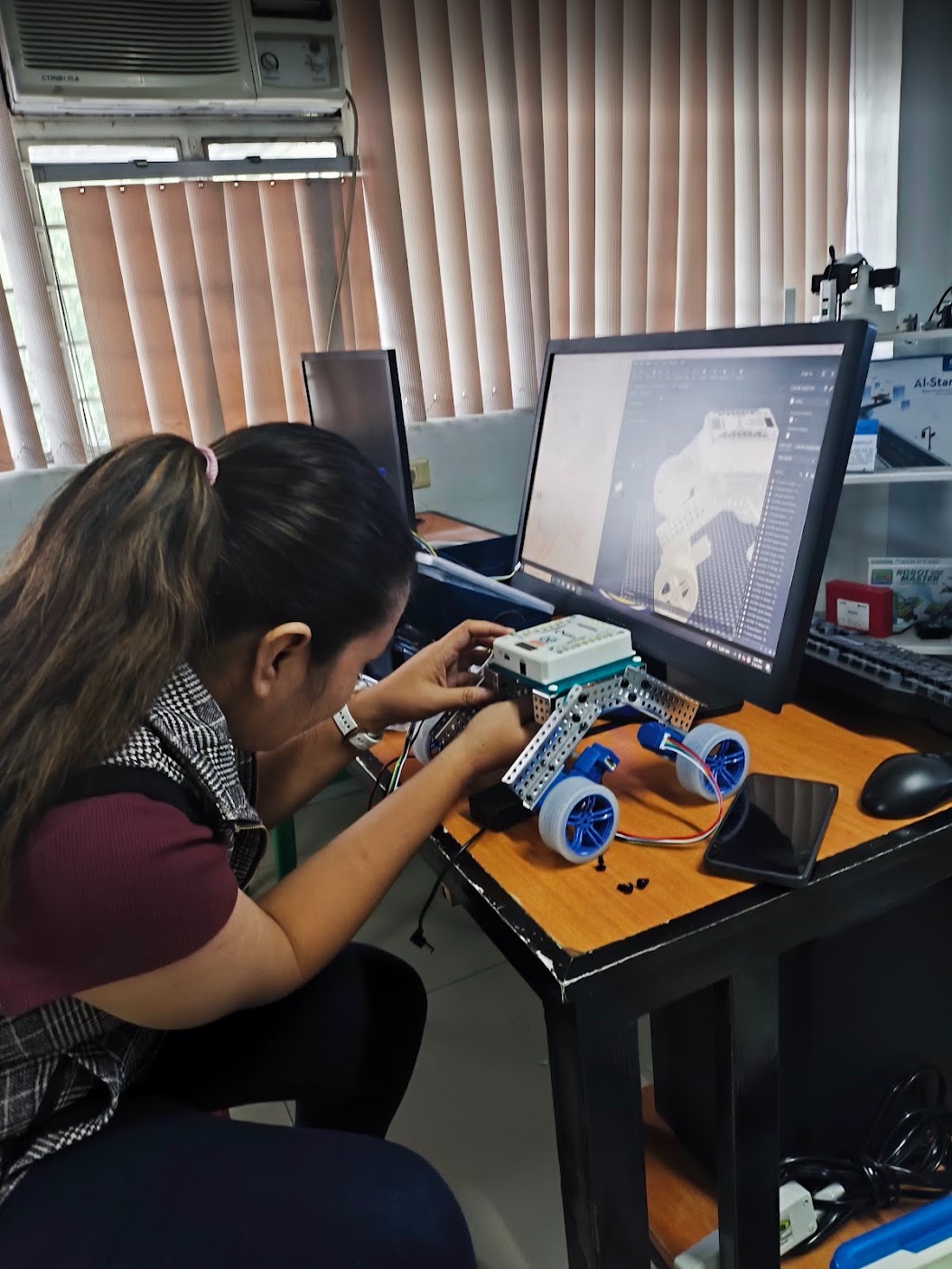 Kat Hervera assembling and configuring a MATRIX mobile robot